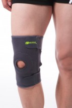 Wraparound knee brace with spring